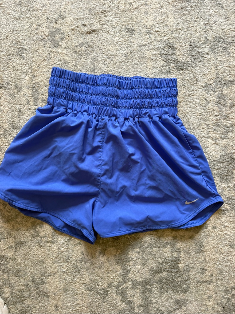 Nike Women's High-Rise Smocked Waist Athletic Shorts in Blue